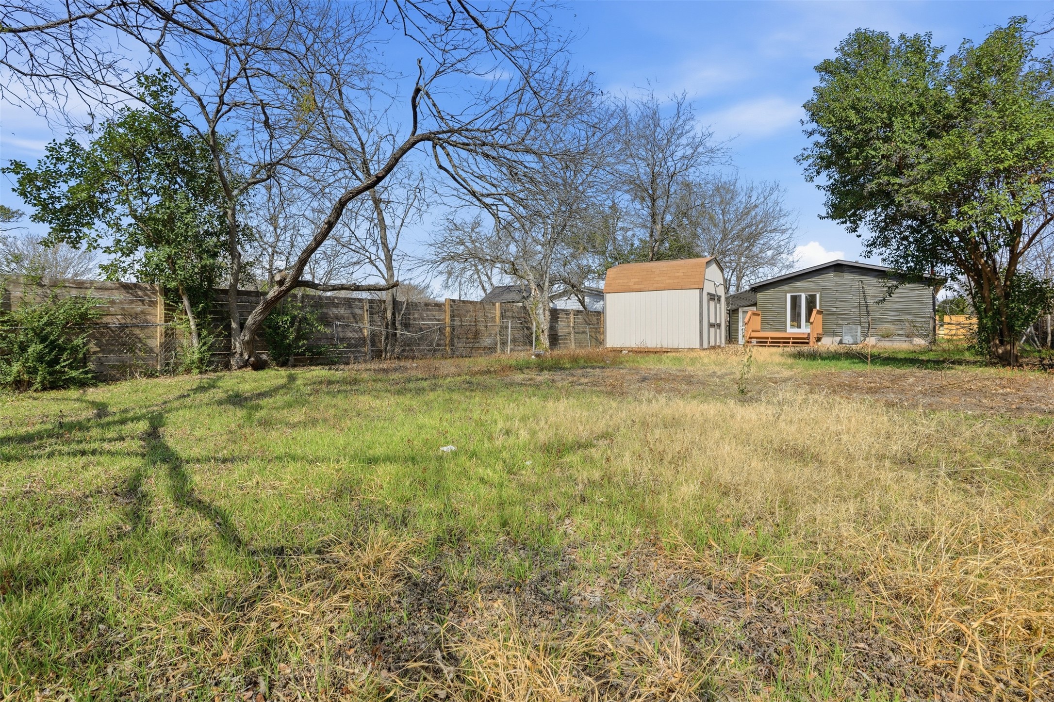 5601 Samuel Huston Avenue Austin, TX 78721 - Photo 24 of 24 Fenced backyard with a storage unit