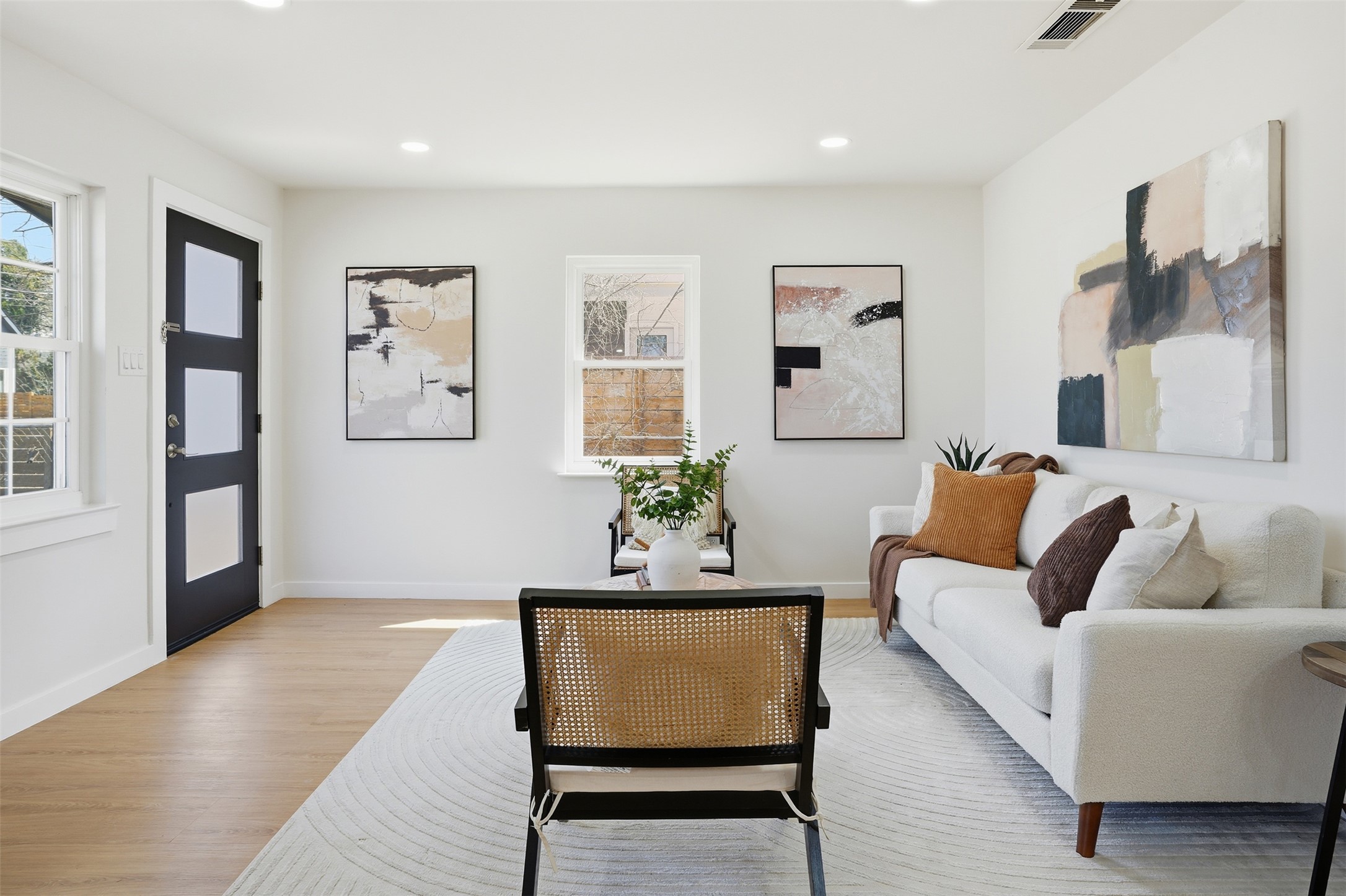 5601 Samuel Huston Avenue Austin, TX 78721 - Photo 6 of 24 Living room with wood finished floors and recessed lighting