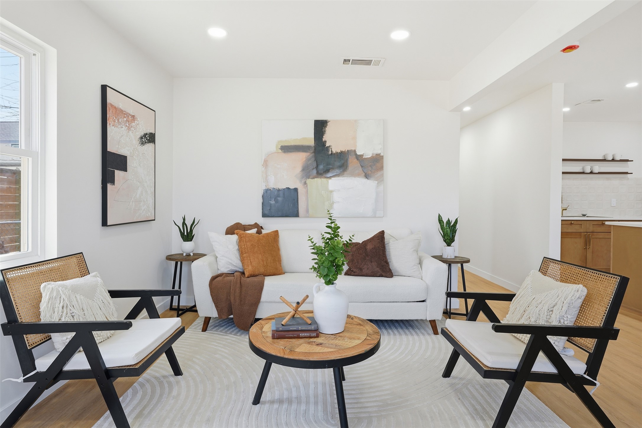 5601 Samuel Huston Avenue Austin, TX 78721 - Photo 8 of 24 Living room with light wood-style flooring and recessed lighting