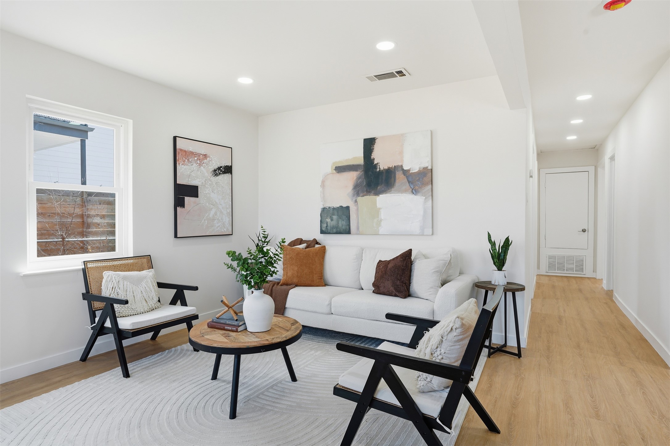 5601 Samuel Huston Avenue Austin, TX 78721 - Photo 9 of 24 Living room featuring light wood-style floors and recessed lighting