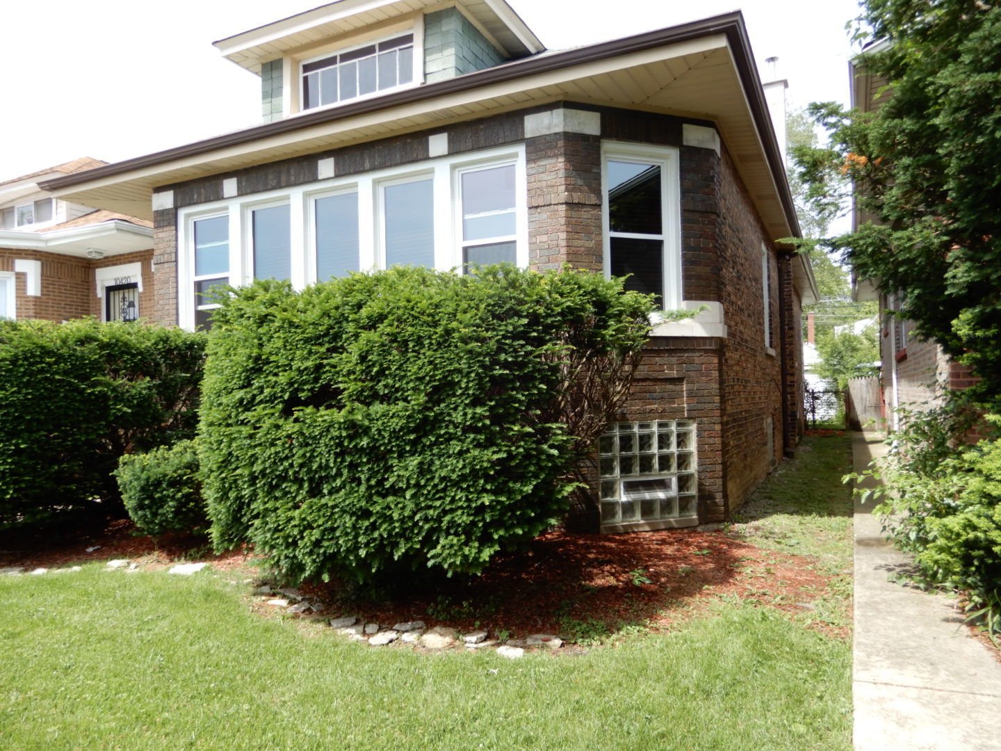 10416 South Sangamon Street Chicago, IL 60643 - Photo 3 of 95 a front view of a house with a yard