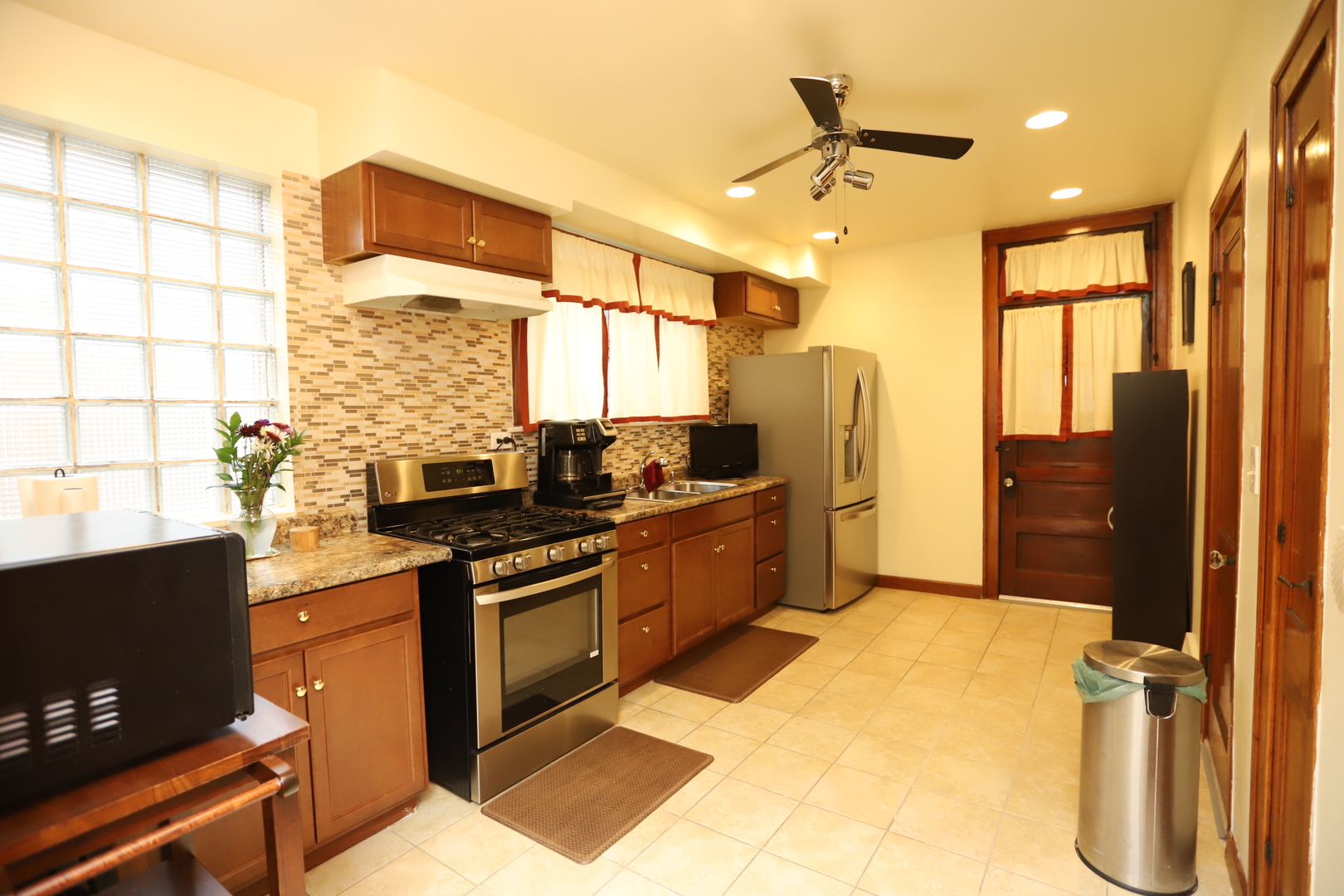 10416 South Sangamon Street Chicago, IL 60643 - Photo 39 of 95 a kitchen with stainless steel appliances granite countertop a stove a sink and a refrigerator