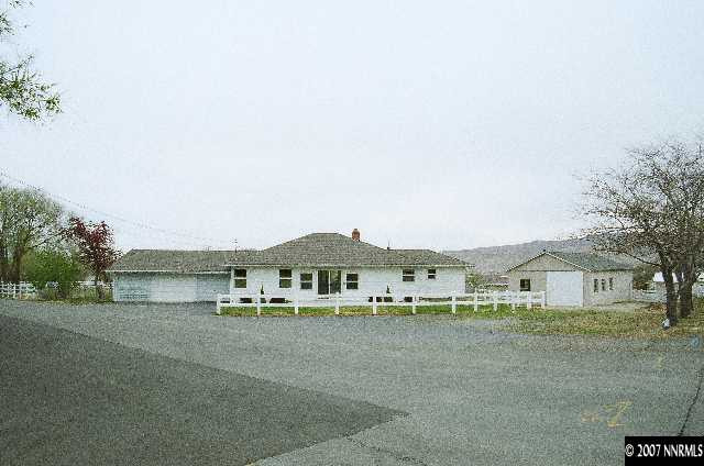 12930 Valley Springs Road Reno, NV 89511 - Photo 2 of 8 a view of house with outdoor space and garden