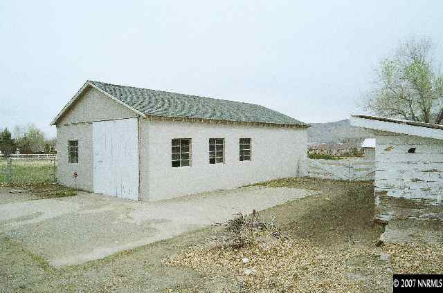 12930 Valley Springs Road Reno, NV 89511 - Photo 3 of 8 a view of a house with a yard