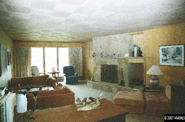 12930 Valley Springs Road Reno, NV 89511 - Photo 5 of 8 a living room with furniture and a large window