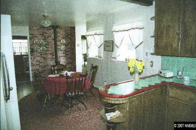 12930 Valley Springs Road Reno, NV 89511 - Photo 6 of 8 a room with furniture and a chandelier