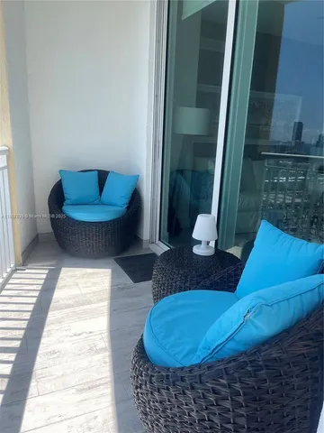 a living room with furniture and a rug