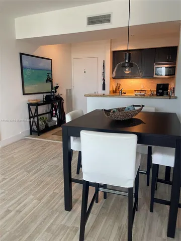 a view of kitchen and dining area with furniture