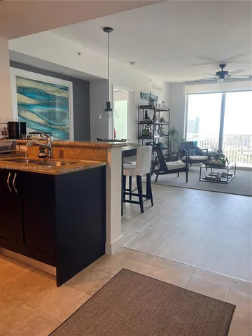 a view of living room with furniture and window