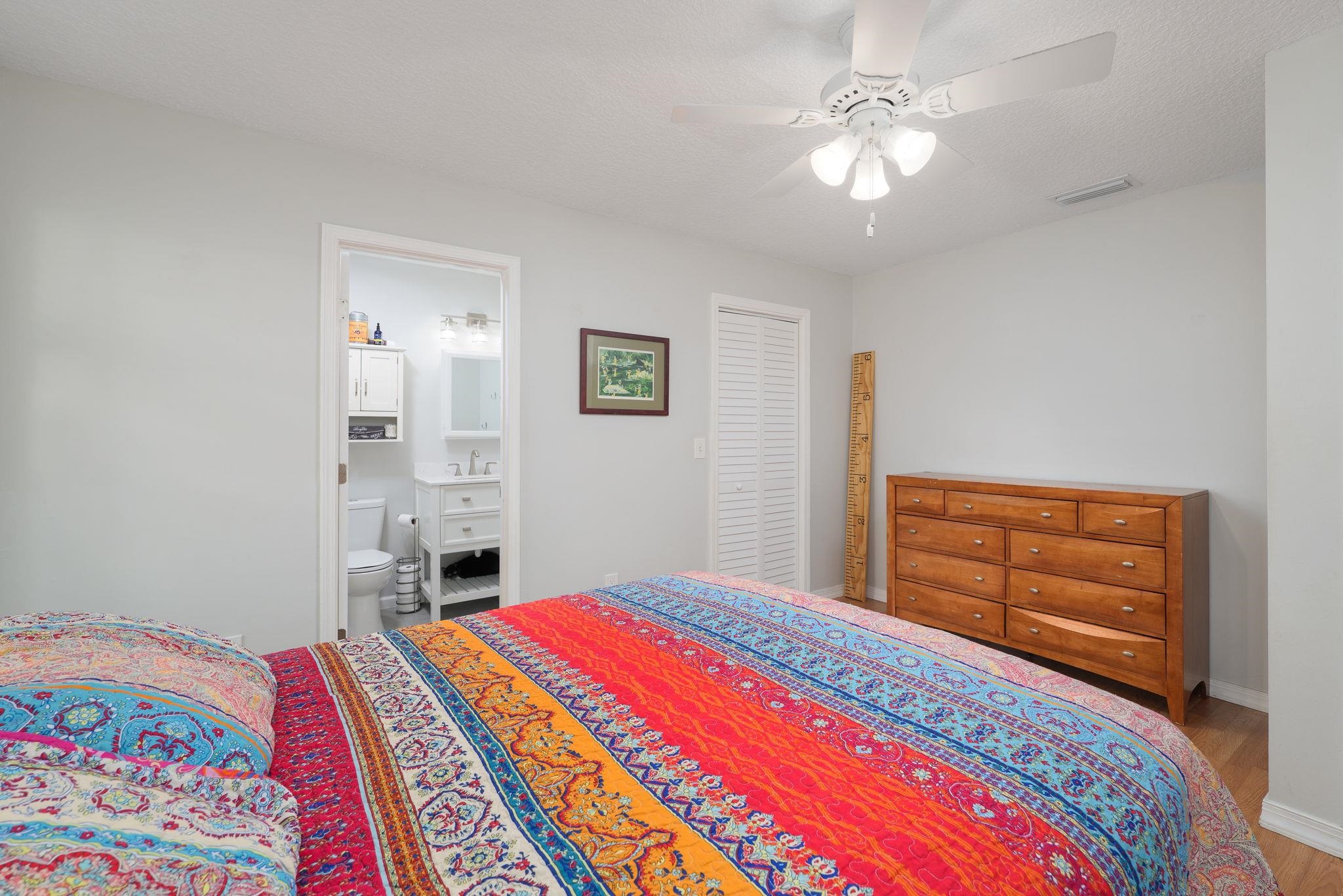 133 Mohegan Road St. Augustine, FL 32086 - Photo 14 of 24 a bedroom with a bed and a chandelier