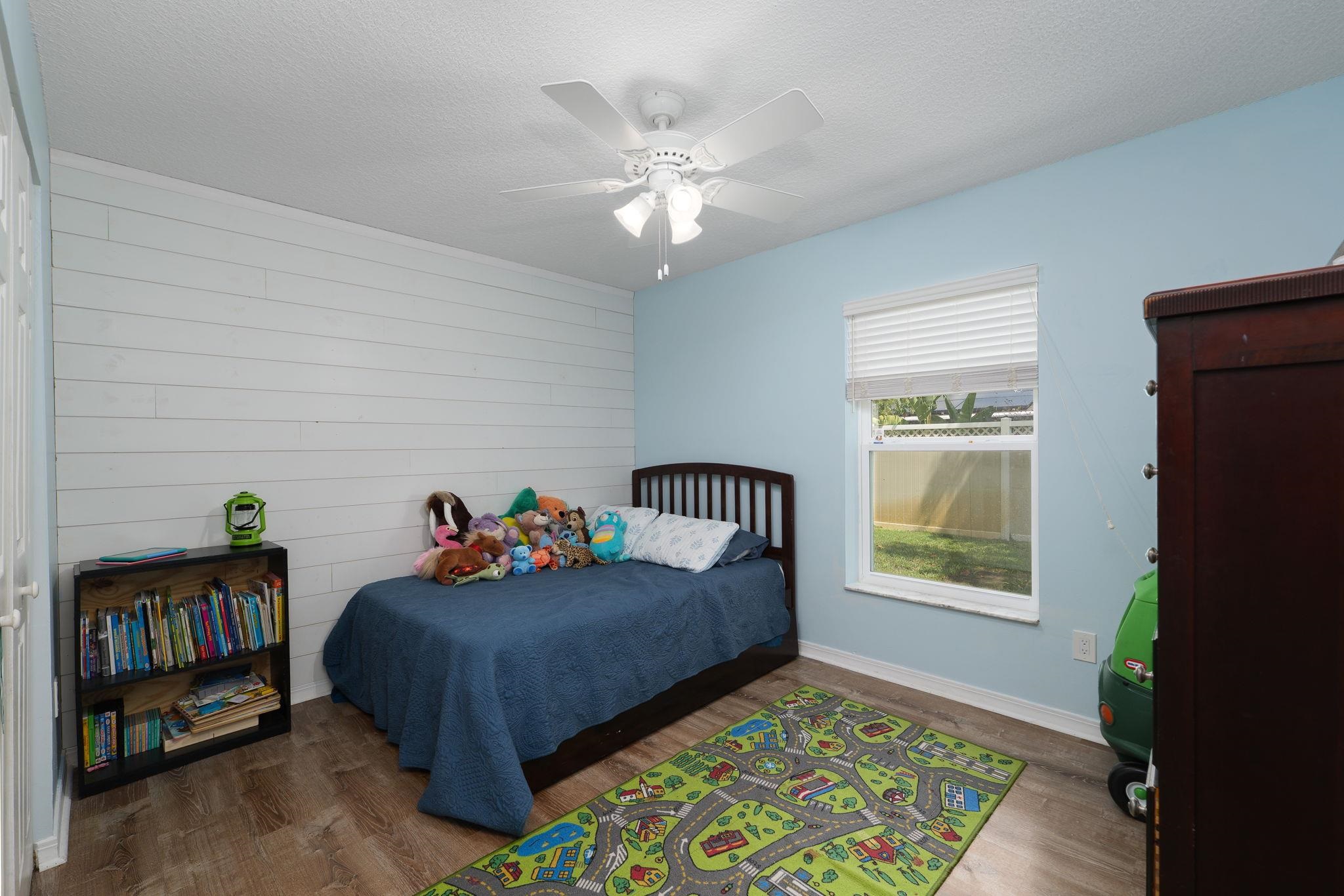 133 Mohegan Road St. Augustine, FL 32086 - Photo 17 of 24 a bed room with a bed and a window