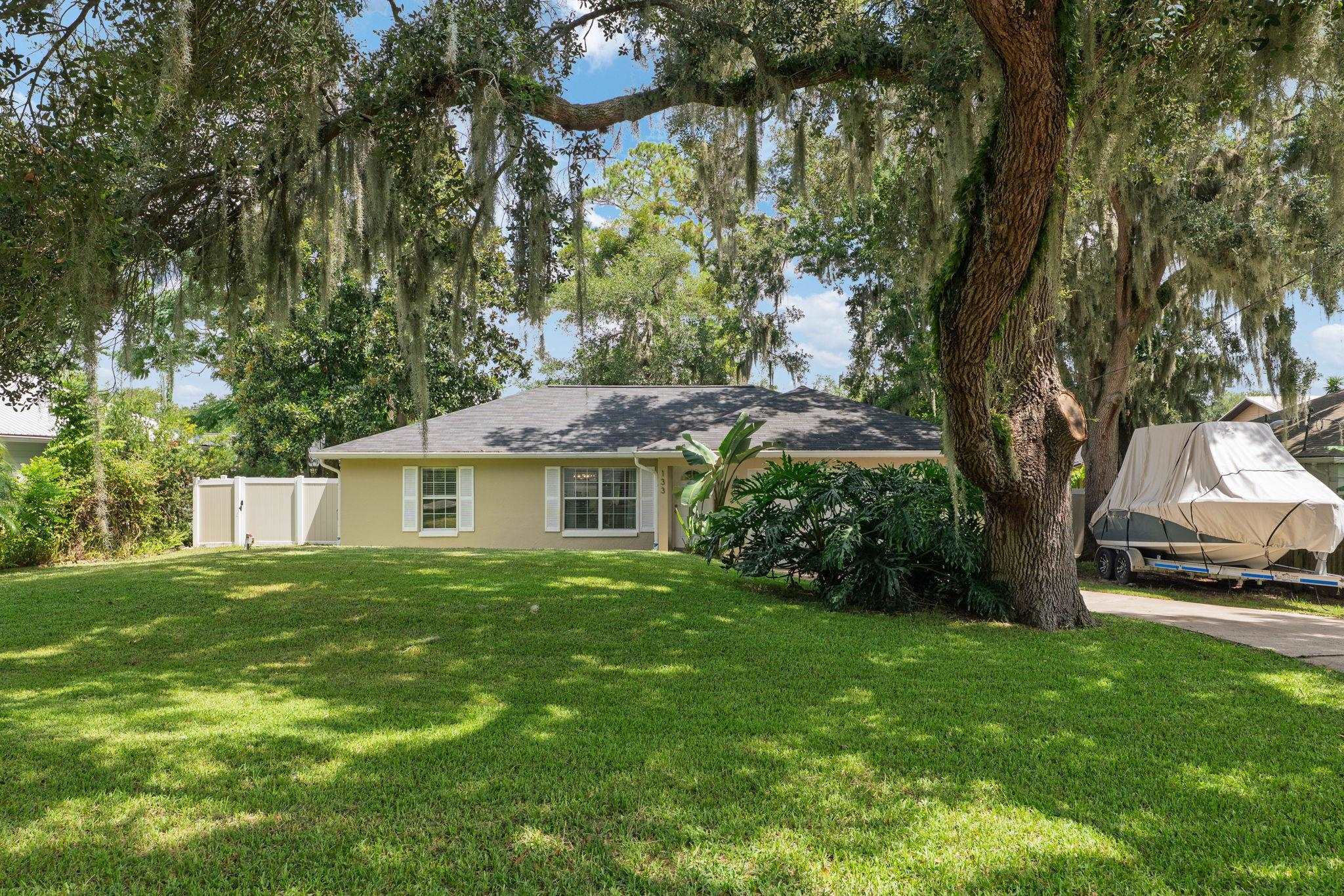 133 Mohegan Road St. Augustine, FL 32086 - Photo 2 of 24 a view of a house with a garden