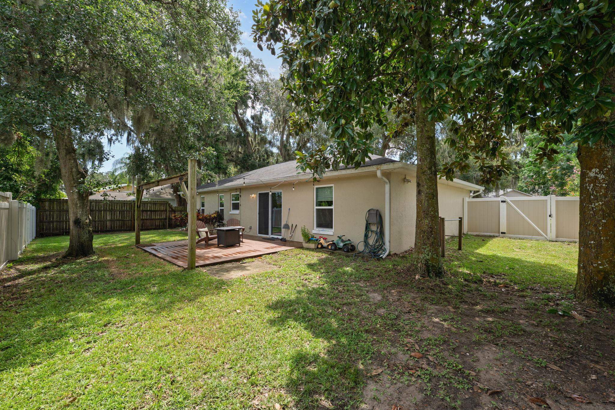 133 Mohegan Road St. Augustine, FL 32086 - Photo 24 of 24 a view of a house with backyard and sitting area