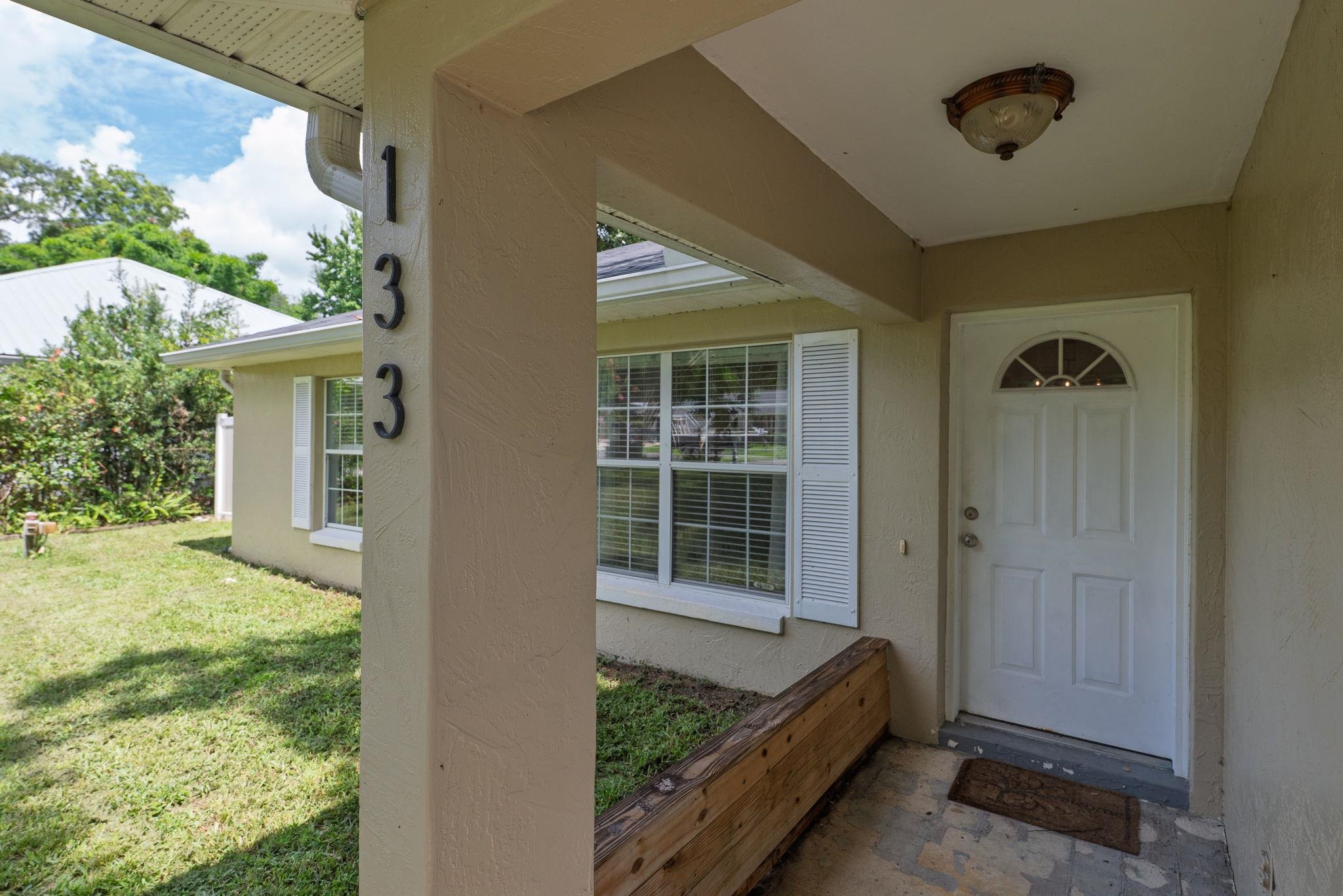 133 Mohegan Road St. Augustine, FL 32086 - Photo 4 of 24 a view of house exterior with furniture and garden