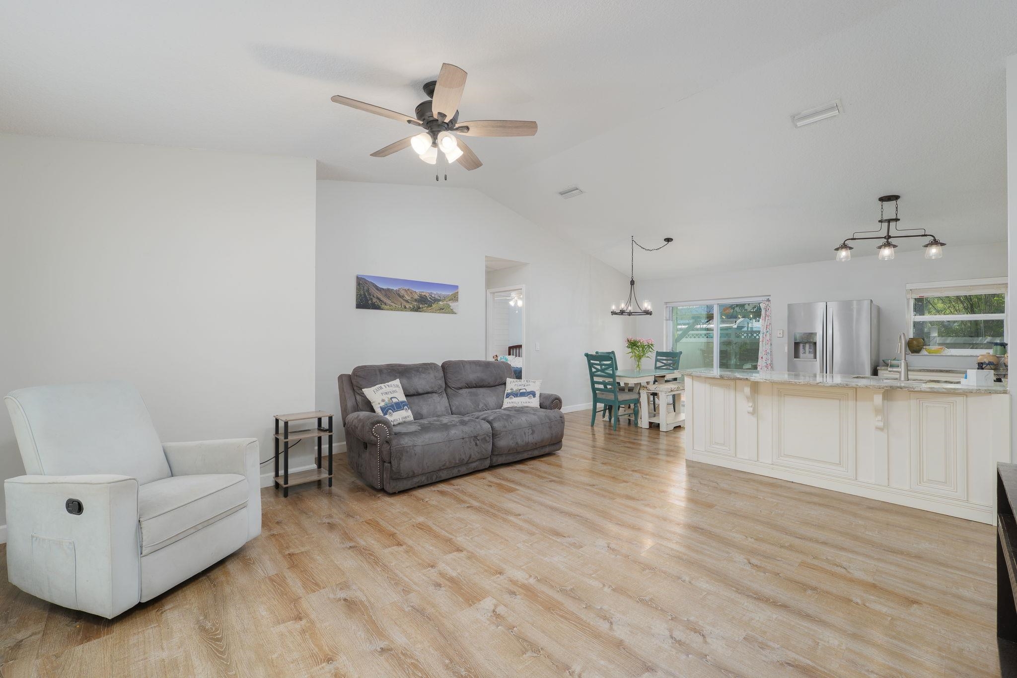 133 Mohegan Road St. Augustine, FL 32086 - Photo 5 of 24 a living room with furniture and a wooden floor