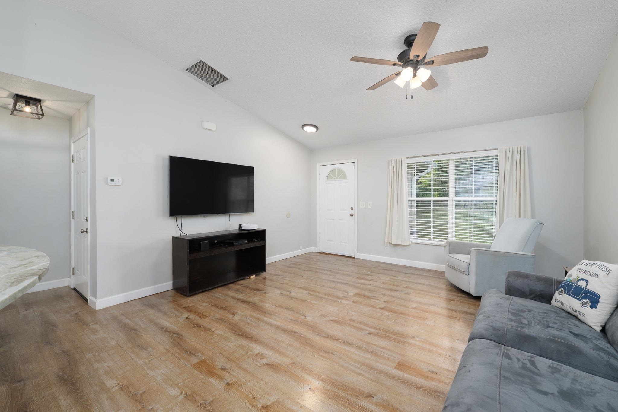 133 Mohegan Road St. Augustine, FL 32086 - Photo 7 of 24 a bedroom with a bed a tv and a couch