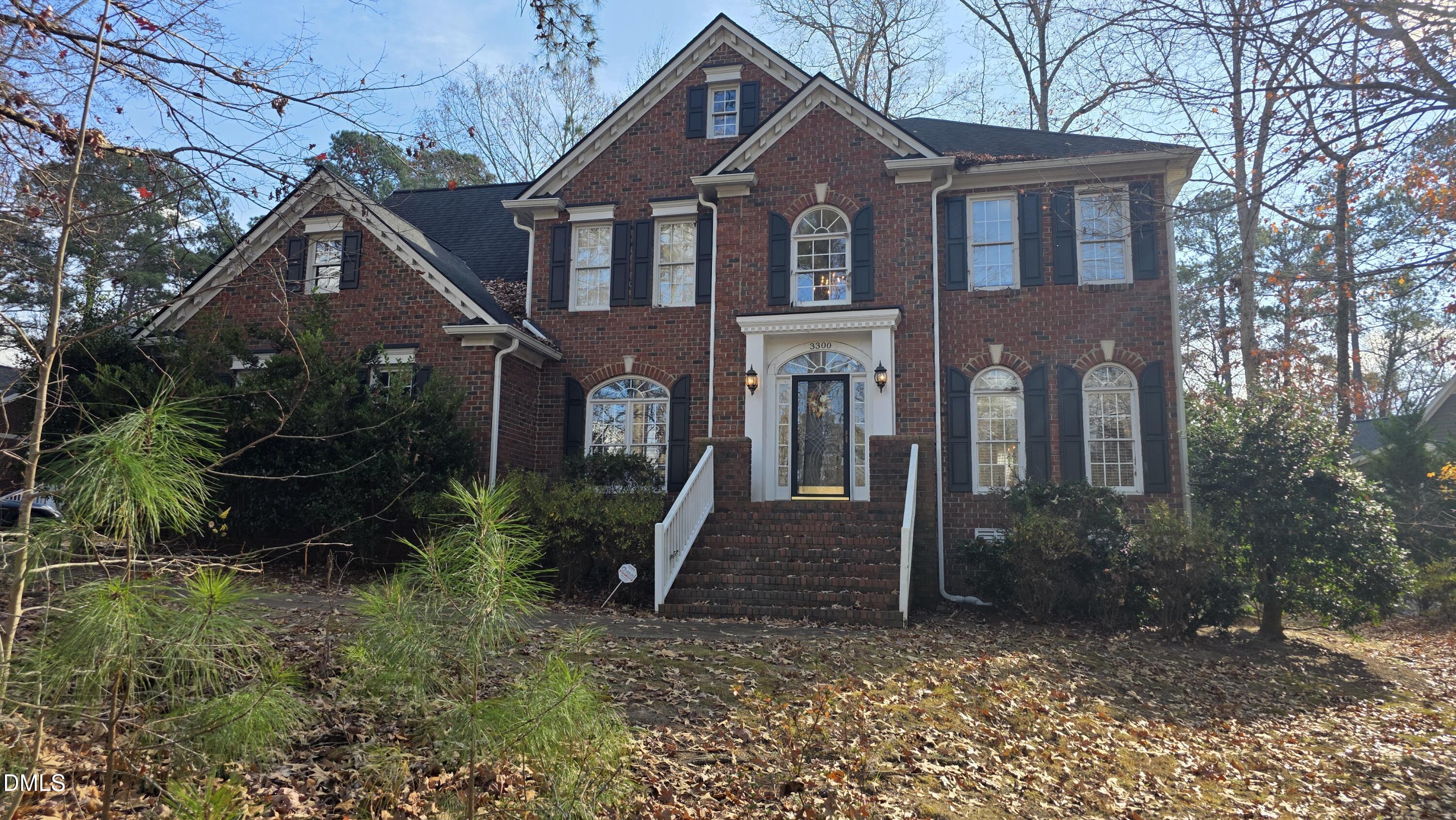3300 Kemble Ridge Drive Wake Forest, NC 27587 - Photo 1 of 12 a front view of a house with garden