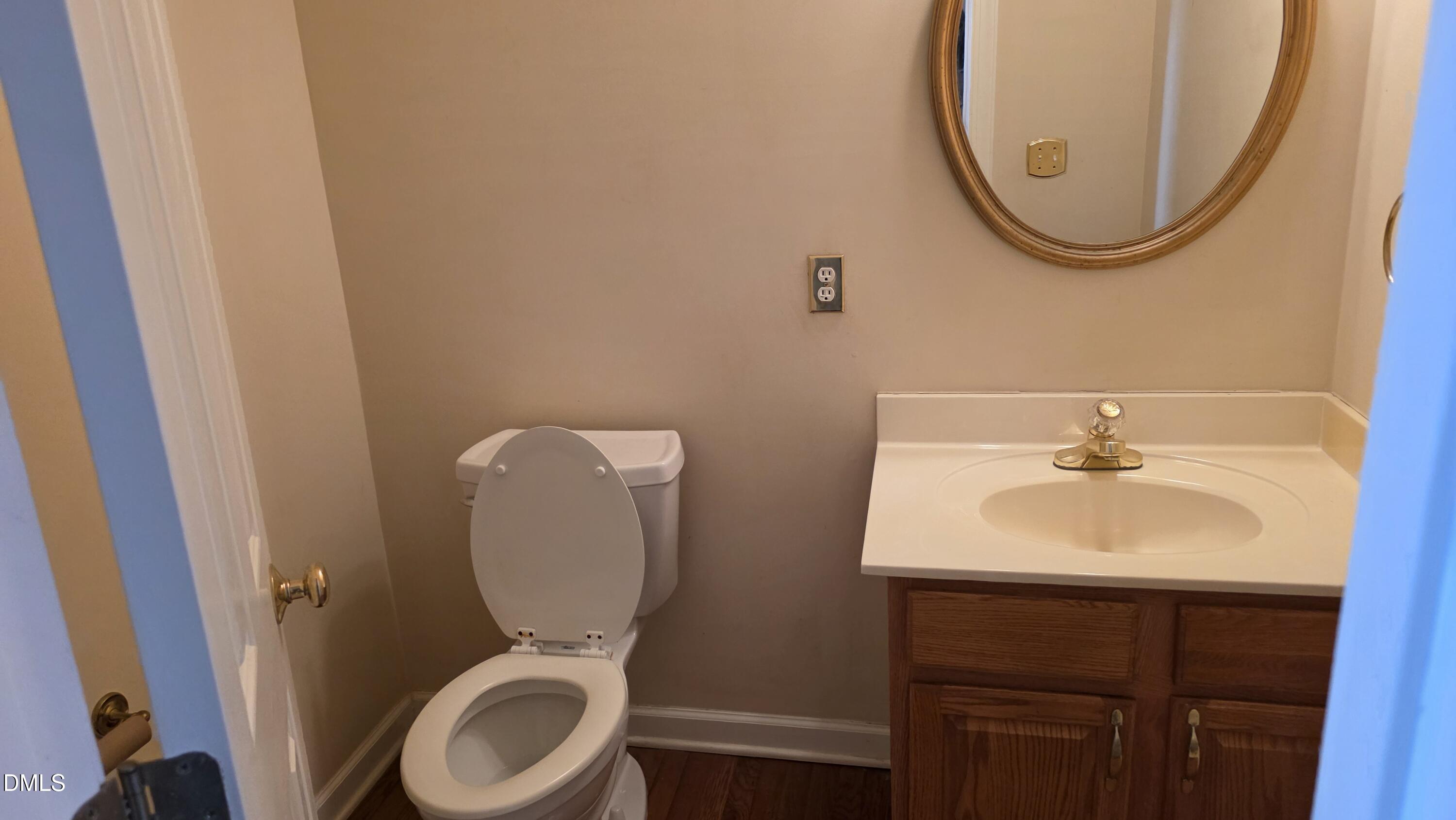 3300 Kemble Ridge Drive Wake Forest, NC 27587 - Photo 6 of 12 a bathroom with a sink mirror and toilet