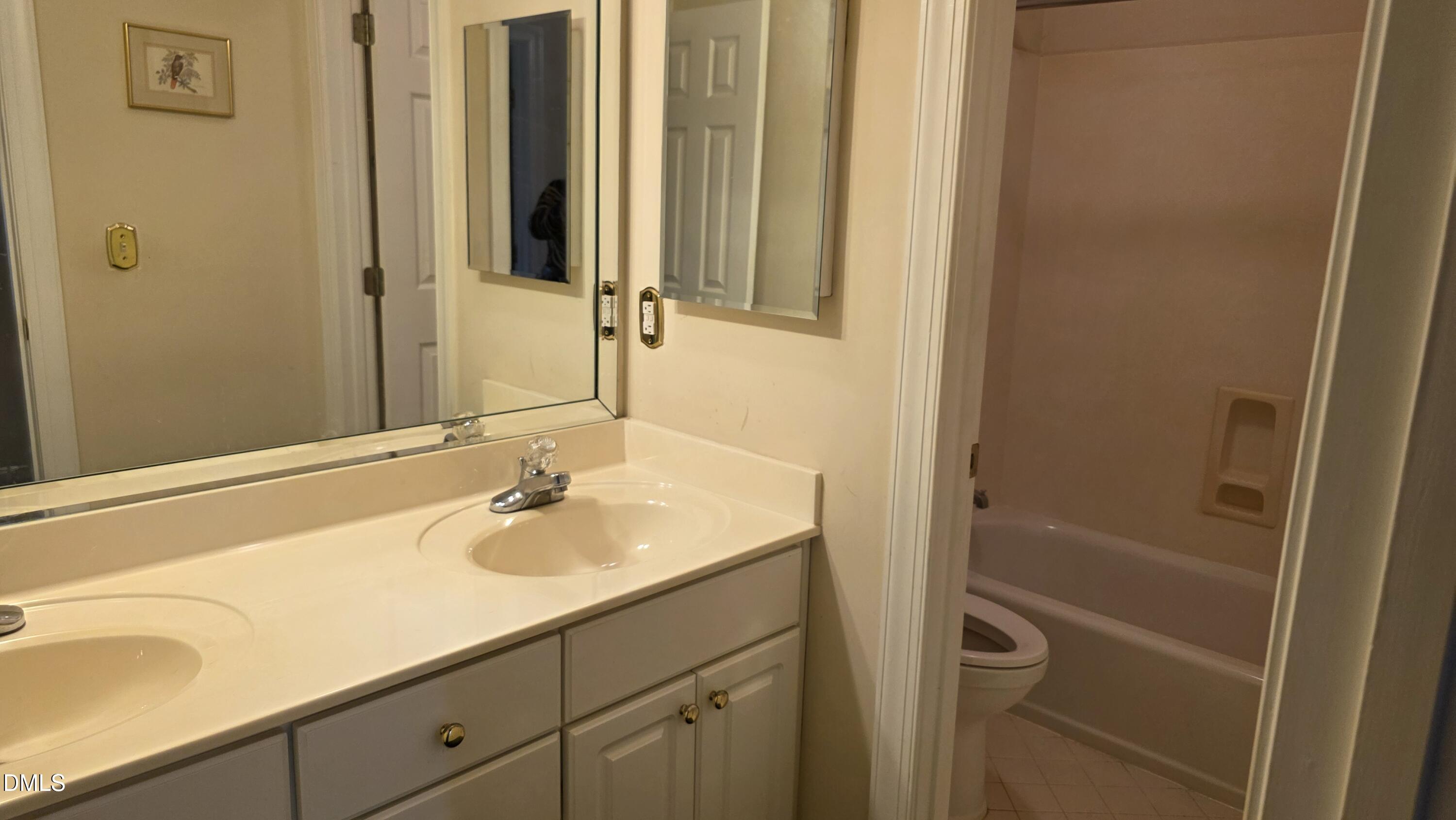 3300 Kemble Ridge Drive Wake Forest, NC 27587 - Photo 8 of 12 a bathroom with a sink and a mirror