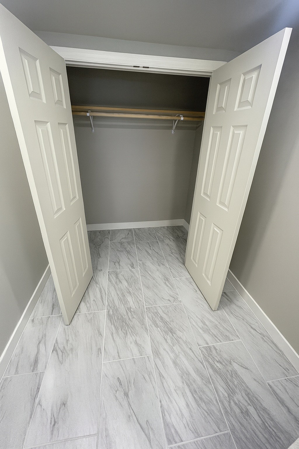 605 Montgomery Street Cowan, TN 37318 - Photo 4 of 7 a view of an empty room with wooden floor and stairs