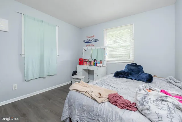 a bed room with a bed and a window