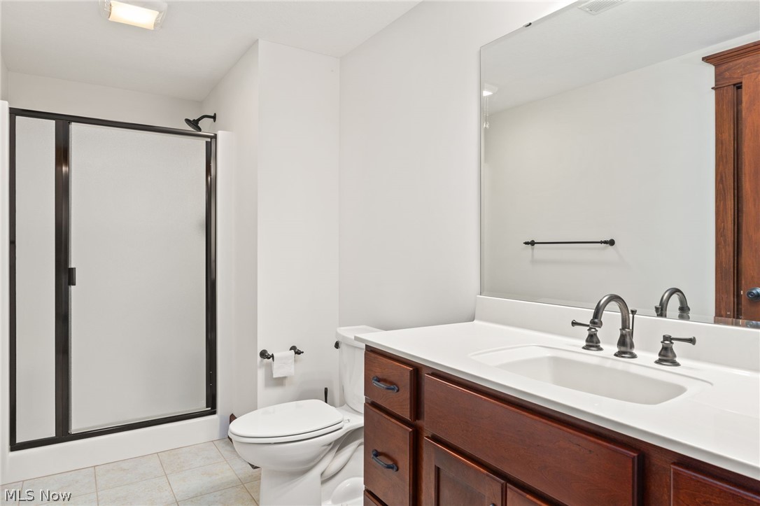6925 River Styx Road Medina, OH 44256 - Photo 39 of 49 Bathroom featuring a dark wood-finish vanity with a white countertop and integrated sink