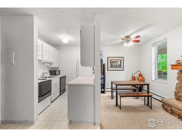 a living room with furniture a piano and a window