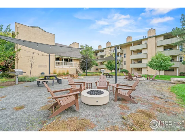 a view of a field of grass and trees