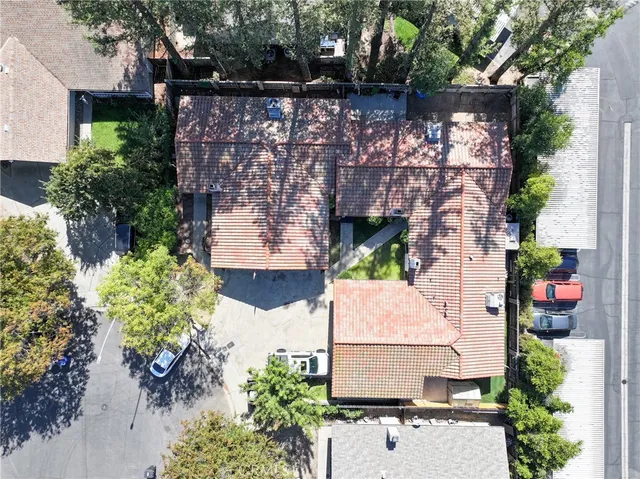 an aerial view of a house with a yard