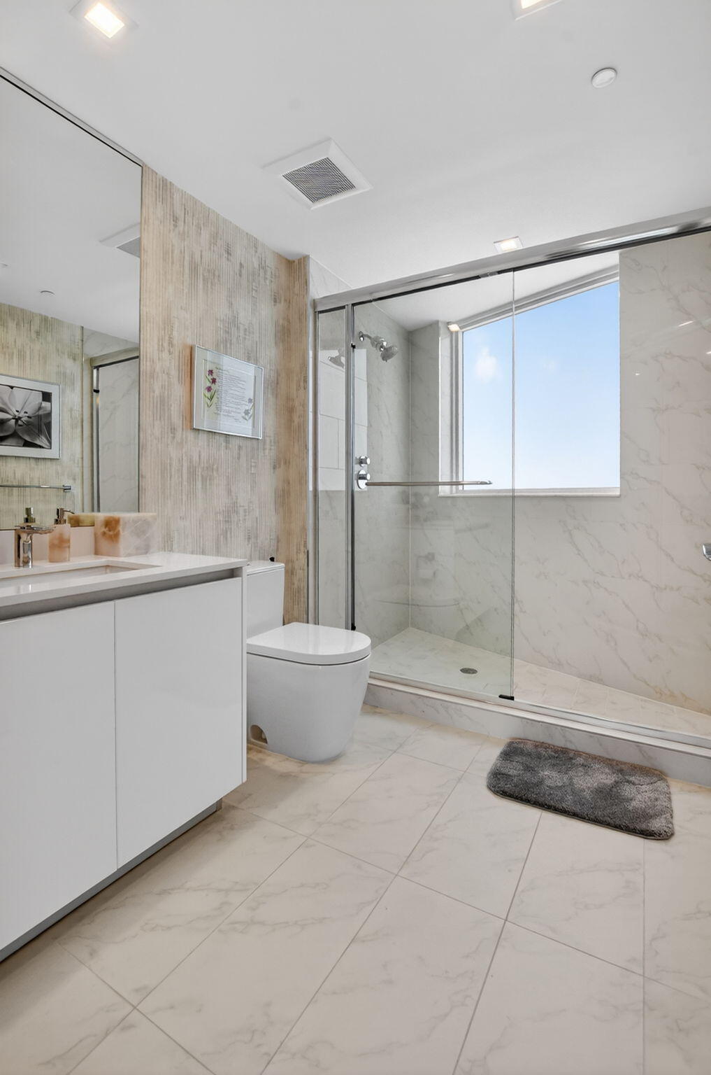 20155 Boca W Drive, Unit B701 Boca Raton, FL 33434 - Photo 35 of 78 a bathroom with a granite countertop sink a toilet and bathtub