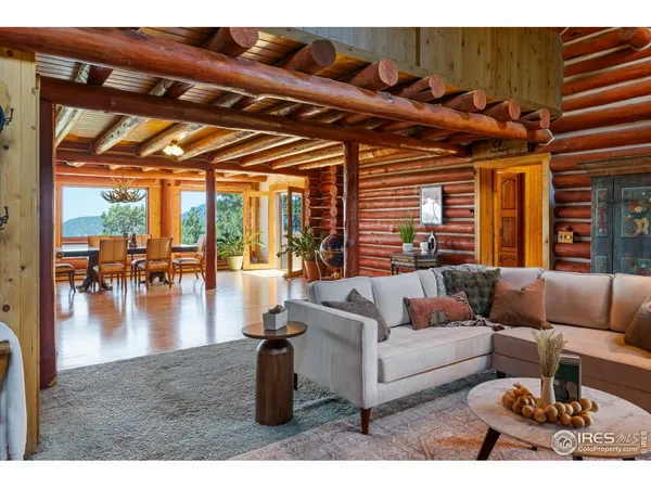 a view of a livingroom with furniture and a fireplace