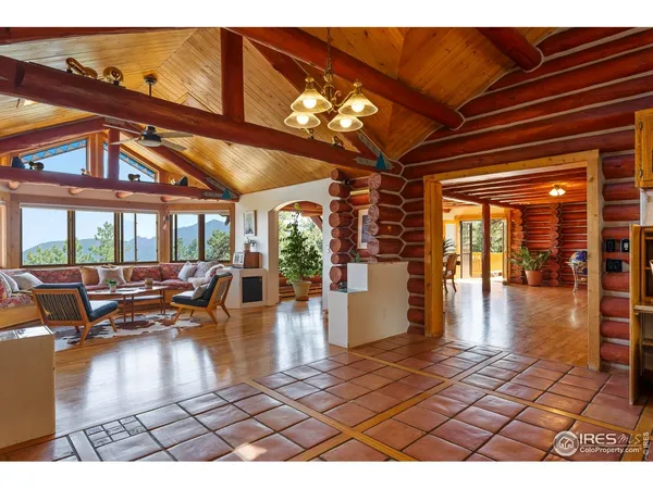 a living room with lots of furniture and wooden floors