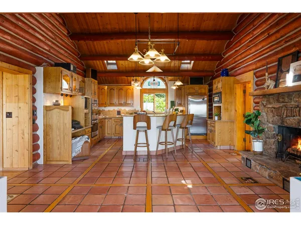 a kitchen that has a sink and a stove