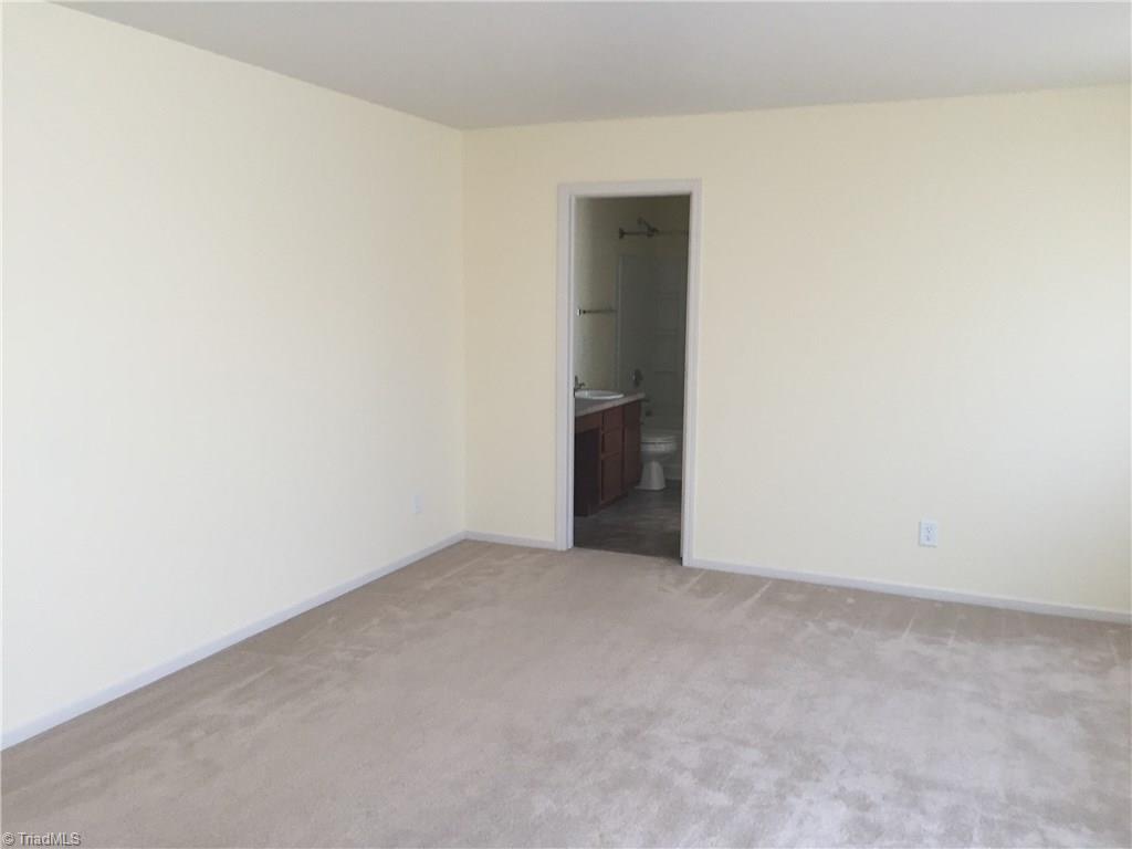 749 Runningbrook Lane Rural Hall, NC 27045 - Photo 14 of 21 Master Bedroom with Bathroom
