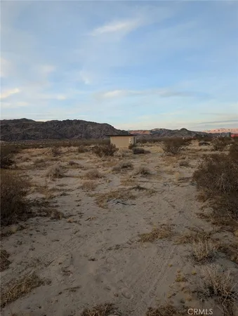a view of ocean and mountains