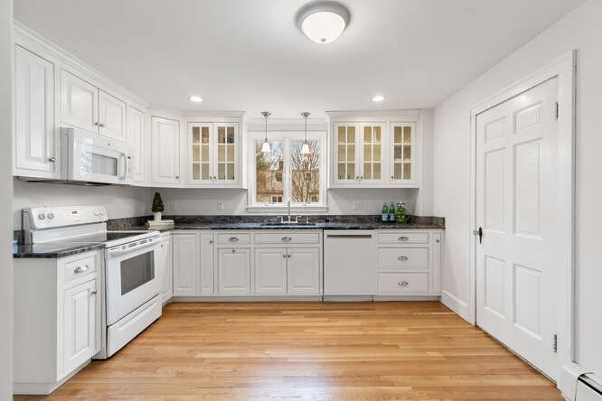 84 Gleason Road Lexington, MA 02420 - Photo 11 of 32 a large kitchen with stainless steel appliances granite countertop a stove and a sink