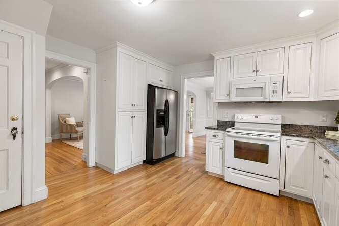 84 Gleason Road Lexington, MA 02420 - Photo 13 of 32 a kitchen with a stove a refrigerator and a sink