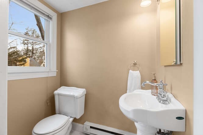84 Gleason Road Lexington, MA 02420 - Photo 17 of 32 a bathroom with a sink mirror and toilet