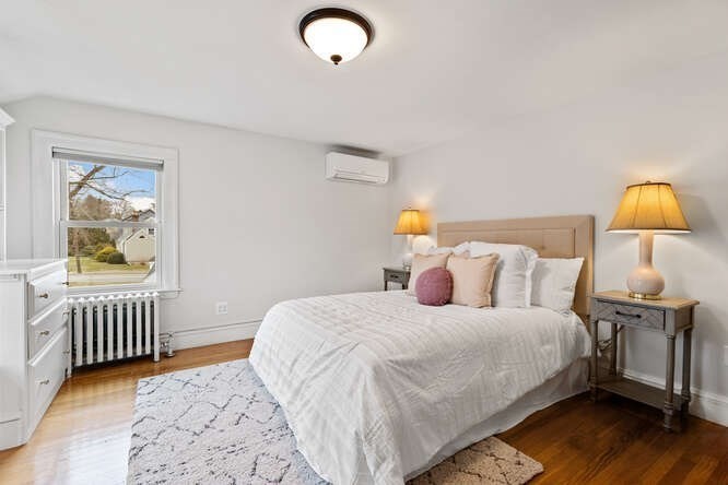 84 Gleason Road Lexington, MA 02420 - Photo 20 of 32 a bedroom with a bed and a window