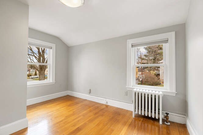 84 Gleason Road Lexington, MA 02420 - Photo 23 of 32 a view of a room with wooden floor and windows