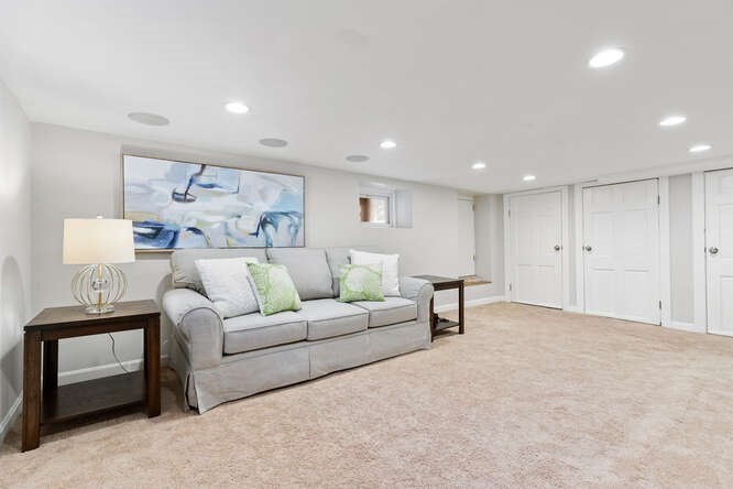 84 Gleason Road Lexington, MA 02420 - Photo 27 of 32 a living room with furniture and a lamp