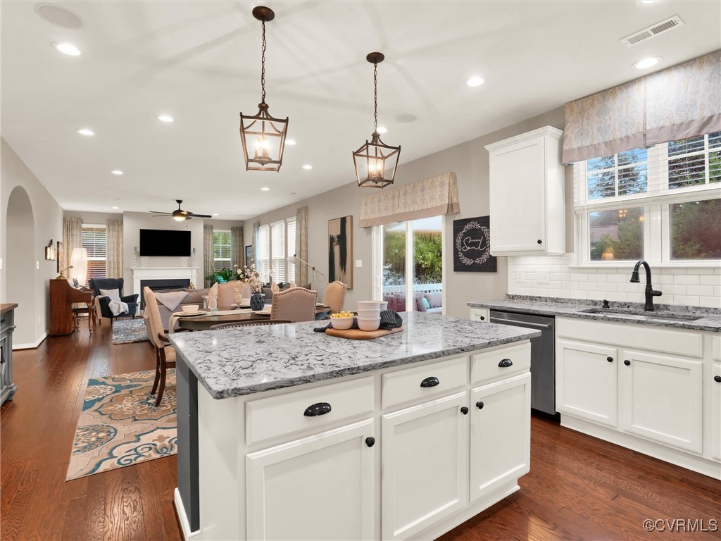 10168 Kellys Bluff Run Ashland, VA 23005 - Photo 16 of 50 a kitchen with center island and living room