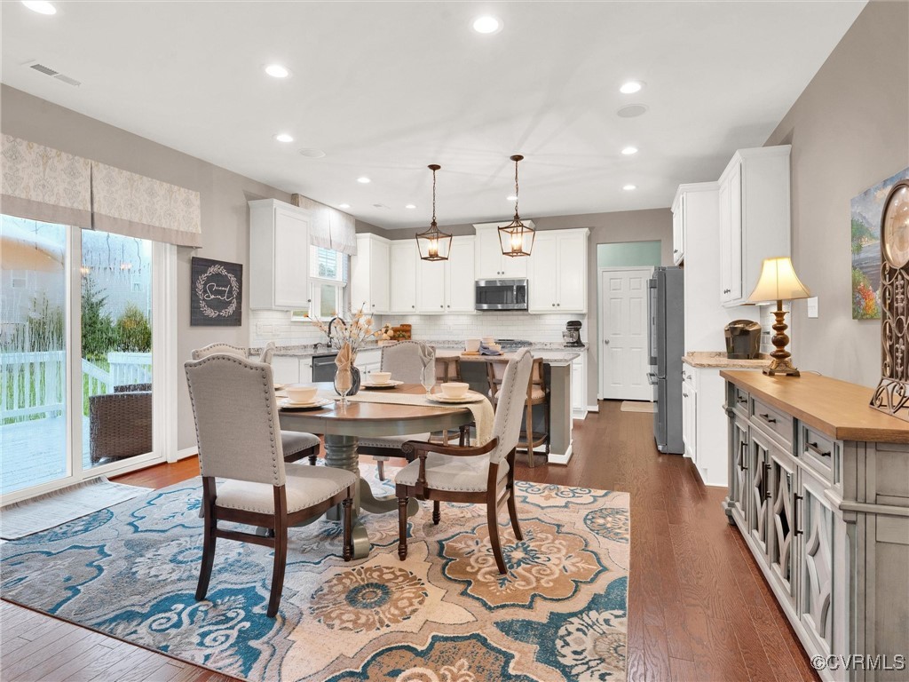 10168 Kellys Bluff Run Ashland, VA 23005 - Photo 17 of 50 a view of a dining room with furniture window and wooden floor