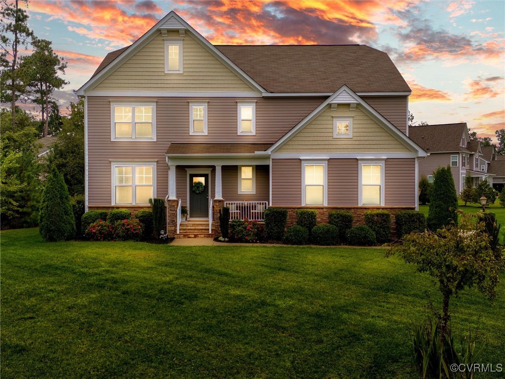 10168 Kellys Bluff Run Ashland, VA 23005 - Photo 2 of 50 a front view of a house with a yard