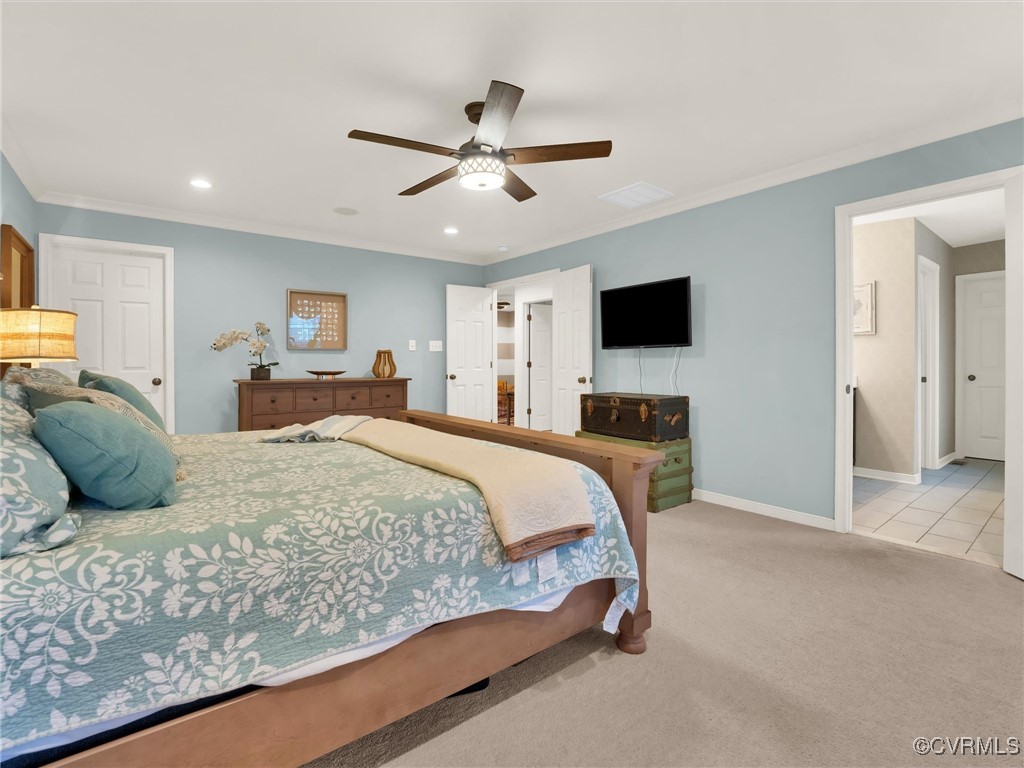 10168 Kellys Bluff Run Ashland, VA 23005 - Photo 22 of 50 a bedroom with a large bed and a tv