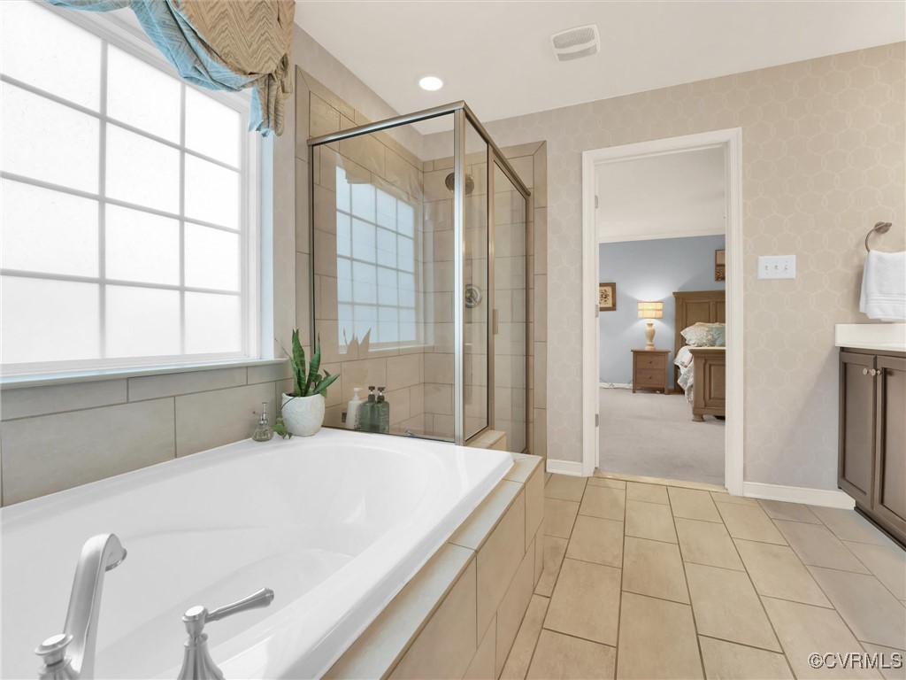 10168 Kellys Bluff Run Ashland, VA 23005 - Photo 24 of 50 a bathroom with a bathtub and a shower