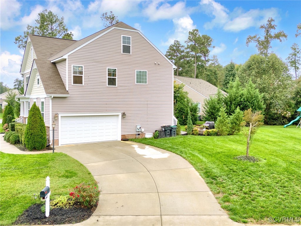 10168 Kellys Bluff Run Ashland, VA 23005 - Photo 38 of 50 a view of a house with a yard