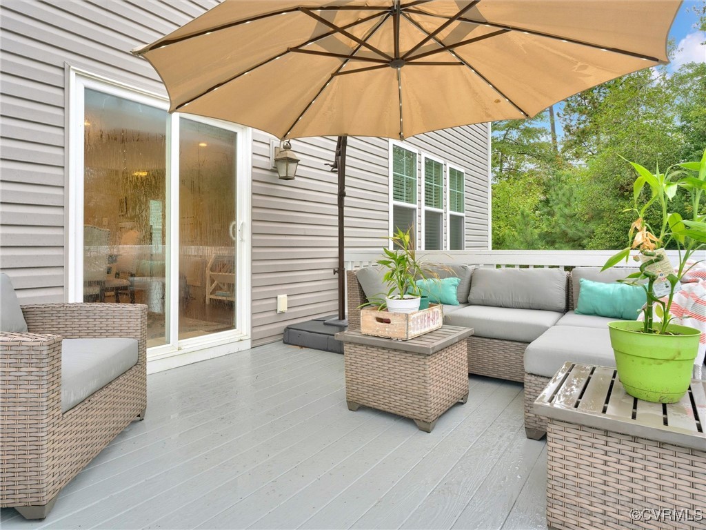 10168 Kellys Bluff Run Ashland, VA 23005 - Photo 40 of 50 a living room with furniture and a yard