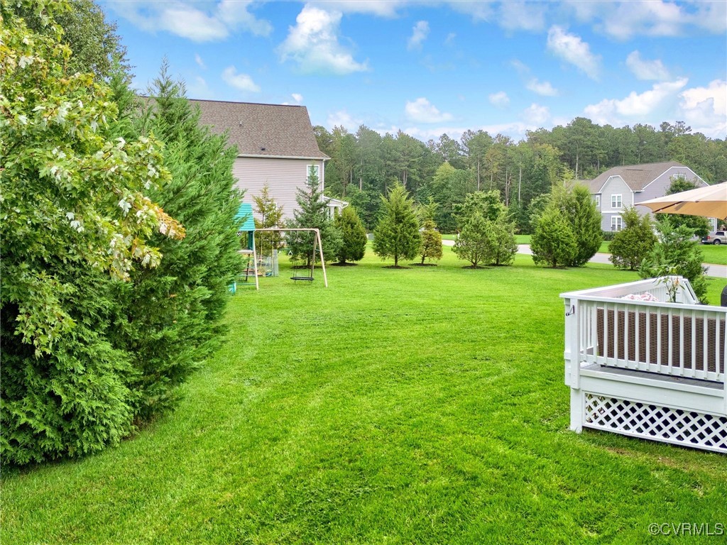 10168 Kellys Bluff Run Ashland, VA 23005 - Photo 45 of 50 a view of a table and chairs in the garden