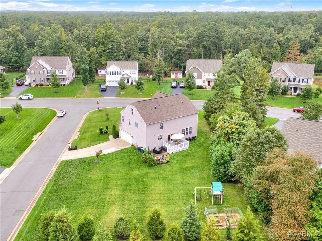 10168 Kellys Bluff Run Ashland, VA 23005 - Photo 46 of 50 an aerial view of a house with a garden and lake view